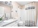 Well-lit bathroom featuring a vanity with a white sink, tub-shower, and stylish fixtures at 6637 Sundown S Dr, Indianapolis, IN 46254
