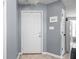 Light and airy entryway featuring tile flooring, a coat closet, and gray paint at 6637 Sundown S Dr, Indianapolis, IN 46254
