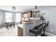 Eat-in kitchen with a breakfast bar featuring pendant lighting and comfortable seating at 6637 Sundown S Dr, Indianapolis, IN 46254