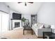 Bright living room with a cozy fireplace, a large television, and comfortable seating at 6637 Sundown S Dr, Indianapolis, IN 46254