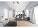 Cozy living room with plush seating, a large window, and an open view of the breakfast bar at 6637 Sundown S Dr, Indianapolis, IN 46254