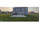Open backyard featuring a basketball hoop on the concrete patio at 6842 Arrowhead Dr, Brownsburg, IN 46112