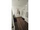 View of shower and door with hooks and wood-look flooring and rug at 6842 Arrowhead Dr, Brownsburg, IN 46112