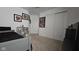Bedroom featuring neutral carpet, comic book art, closet, and a door at 6842 Arrowhead Dr, Brownsburg, IN 46112