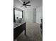 Spacious bedroom with a ceiling fan, closet, and window offering ample natural light at 6842 Arrowhead Dr, Brownsburg, IN 46112