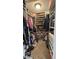 Walk-in closet, equipped with rows of shelving, hanging rods, and shoe racks at 6842 Arrowhead Dr, Brownsburg, IN 46112