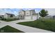 Inviting home with a well-maintained lawn, complemented by a three car attached garage at 6842 Arrowhead Dr, Brownsburg, IN 46112
