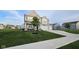 Beautiful home with a lush green lawn, mature tree, and a three car garage at 6842 Arrowhead Dr, Brownsburg, IN 46112