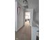 Hallway view leading to a bright room with tray ceiling and lots of natural light at 6842 Arrowhead Dr, Brownsburg, IN 46112