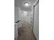 Hallway with white walls, carpet, sliding door, and a staircase to the left at 6842 Arrowhead Dr, Brownsburg, IN 46112