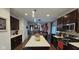 Open kitchen with island and views to the dining and living areas at 6842 Arrowhead Dr, Brownsburg, IN 46112