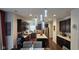 Modern kitchen with stainless steel appliances, an island, and dark wood cabinets and hardware at 6842 Arrowhead Dr, Brownsburg, IN 46112