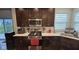 Kitchen featuring stainless steel appliances and dark brown cabinets at 6842 Arrowhead Dr, Brownsburg, IN 46112