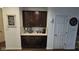 Kitchen nook with dark cabinets, white countertops, and stylish appliances at 6842 Arrowhead Dr, Brownsburg, IN 46112