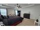 Spacious main bedroom featuring tray ceiling, great natural light, and a comfortable seating area at 6842 Arrowhead Dr, Brownsburg, IN 46112
