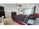 Main bedroom with tray ceiling, barn door and nice furnishings at 6842 Arrowhead Dr, Brownsburg, IN 46112