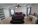 Main bedroom boasts tray ceiling, and dressers, and a comfortable seating area at 6842 Arrowhead Dr, Brownsburg, IN 46112