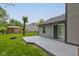 Backyard with a spacious deck area and green lawn at 7239 Wet Rock Ct, Indianapolis, IN 46236