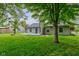 The property has a large backyard with many mature shade trees at 7239 Wet Rock Ct, Indianapolis, IN 46236