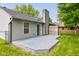 A gray wooden deck stands in the middle of a grassy backyard at 7239 Wet Rock Ct, Indianapolis, IN 46236
