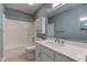 This is a bathroom with a tub, toilet, vanity and mirror at 7239 Wet Rock Ct, Indianapolis, IN 46236