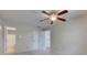 This bedroom has a ceiling fan, double closets, and a view into a bathroom at 7239 Wet Rock Ct, Indianapolis, IN 46236