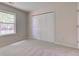 This bedroom includes a closet with folding doors and a window with a view at 7239 Wet Rock Ct, Indianapolis, IN 46236