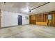 Clean, two-car garage with shelving, ample storage space, and an access door at 7239 Wet Rock Ct, Indianapolis, IN 46236