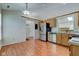 Open kitchen flows into the dining area and features stainless steel appliances at 7239 Wet Rock Ct, Indianapolis, IN 46236