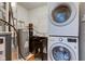 Well-equipped laundry room with washer, dryer, utility sink, and water heater at 7239 Wet Rock Ct, Indianapolis, IN 46236