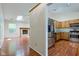 Open concept living area featuring a fireplace and kitchen with stainless steel appliances at 7239 Wet Rock Ct, Indianapolis, IN 46236
