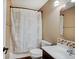 Small bathroom featuring a patterned shower curtain, toilet, and small sink and cabinet at 7372 Oakview Dr, Avon, IN 46123