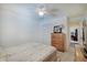 Well-lit bedroom features a ceiling fan, carpet, and closet at 7372 Oakview Dr, Avon, IN 46123