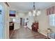 Open kitchen and living area featuring hardwood floors, white cabinetry, and stainless steel appliances at 7372 Oakview Dr, Avon, IN 46123