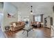Open living room features neutral tones, a ceiling fan and hardwood floors at 7372 Oakview Dr, Avon, IN 46123