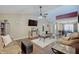 Bright, open-concept living room flowing into the dining area, creating a welcoming and social space at 7372 Oakview Dr, Avon, IN 46123
