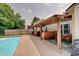 Outdoor space featuring an in-ground pool and covered patio bar at 7372 Oakview Dr, Avon, IN 46123