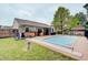 Lush backyard featuring a swimming pool and cozy covered patio area at 7372 Oakview Dr, Avon, IN 46123