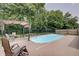 A beautifully maintained in-ground pool set in a green backyard at 7372 Oakview Dr, Avon, IN 46123