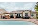 Backyard showcasing a pool and covered patio with outdoor seating at 7372 Oakview Dr, Avon, IN 46123