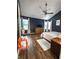 Spacious bedroom featuring hard wood floors, textured ceilings, and large windows for natural light at 7470 Charrington Ct, Indianapolis, IN 46254
