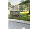 Beautiful Cobblestone community sign surrounded by landscaping, mature trees and well-maintained homes at 7470 Charrington Ct, Indianapolis, IN 46254