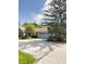 Charming home featuring a light blue garage door and a tree in the front yard at 7470 Charrington Ct, Indianapolis, IN 46254