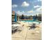 Community swimming pool featuring shaded seating, clear blue water and comfortable chairs at 7470 Charrington Ct, Indianapolis, IN 46254