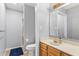 A bathroom featuring a vanity, toilet, and a shower with a curtain at 7616 Derrek Pl, Indianapolis, IN 46219