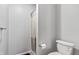 Bathroom featuring a toilet and a shower with curtain at 7616 Derrek Pl, Indianapolis, IN 46219