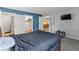 A bedroom features an ensuite bathroom and a kitchen with French doors at 7616 Derrek Pl, Indianapolis, IN 46219