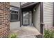 Charming entryway featuring sidelight windows, and blooming decorative flowers at 7616 Derrek Pl, Indianapolis, IN 46219