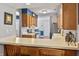 Eat-in kitchen with breakfast bar, stainless appliances, and great natural light at 7616 Derrek Pl, Indianapolis, IN 46219