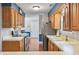 Well-lit kitchen features stainless appliances, modern countertops, and lots of cabinets at 7616 Derrek Pl, Indianapolis, IN 46219